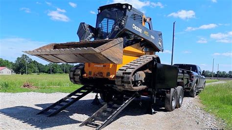 best way to haul a skid steer|dump trailer loading skid steer.